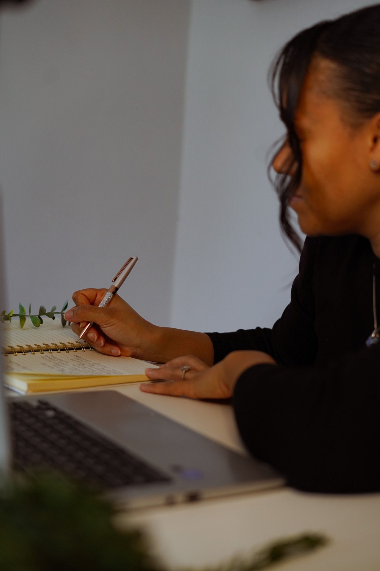 Lottie writing at her desk, focused and calm